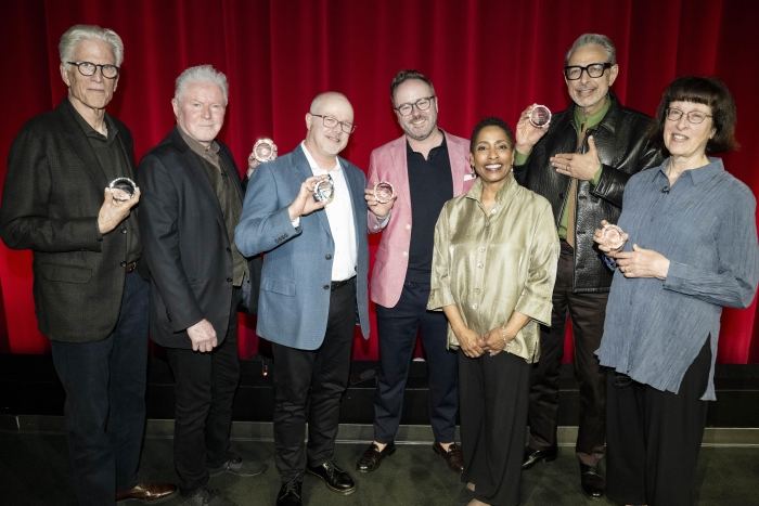 Panelists on stage holding awards at the Los Angeles premiere of the Henry David Thoreau documentary